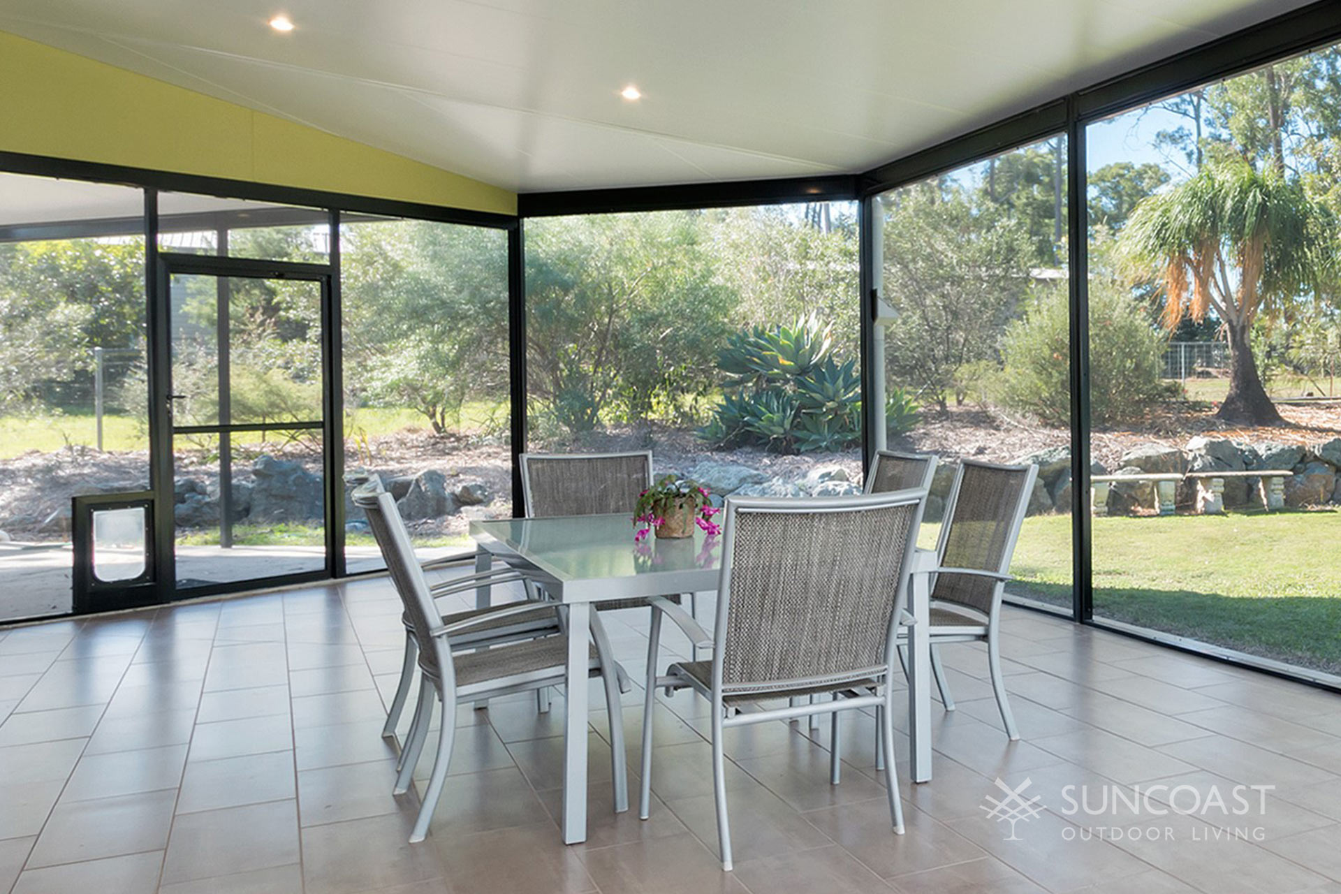 Screened enclosure with pet door and outdoor dining area